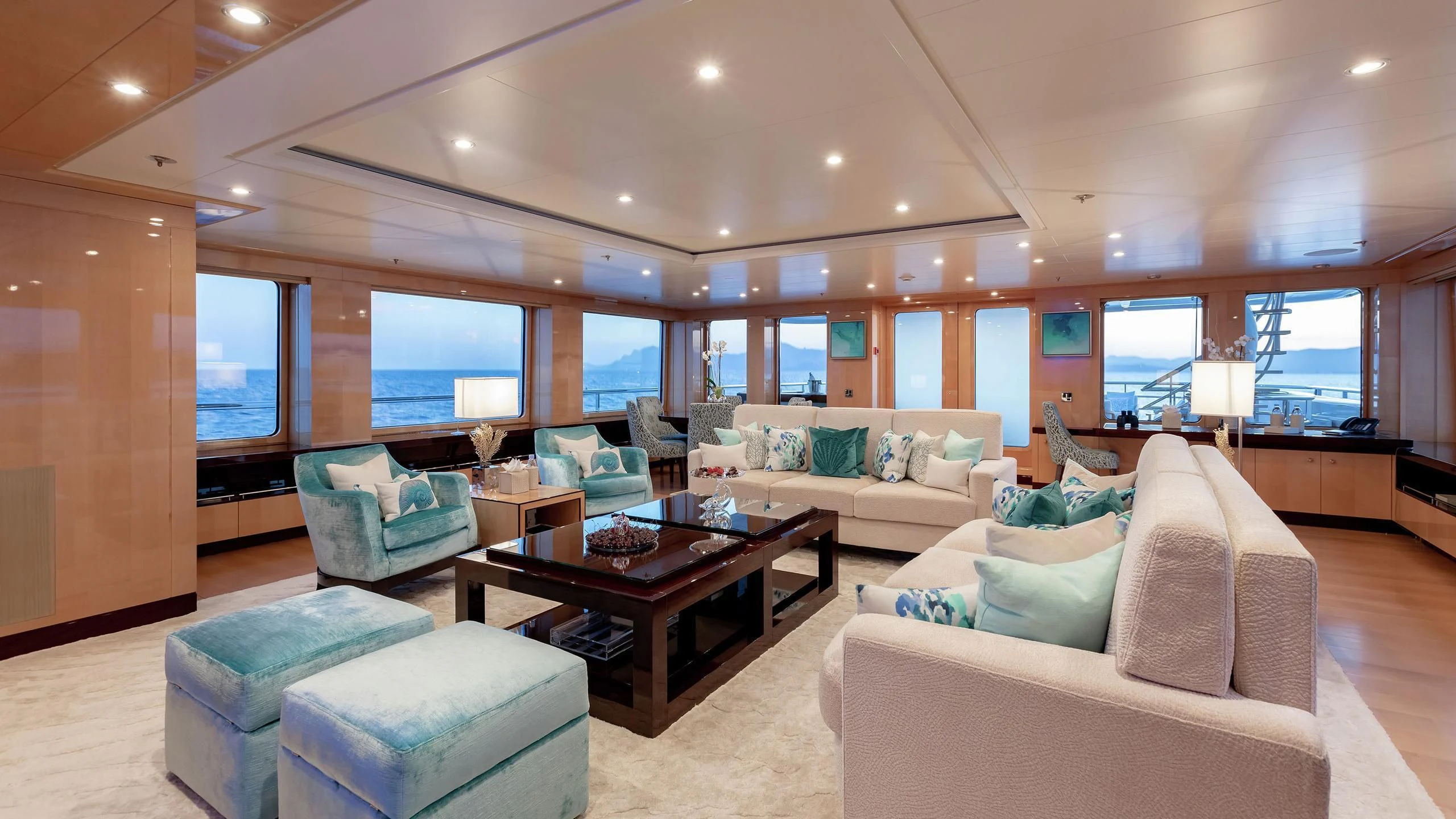 a living room with a large window aboard LA MIRAGE Yacht for Sale