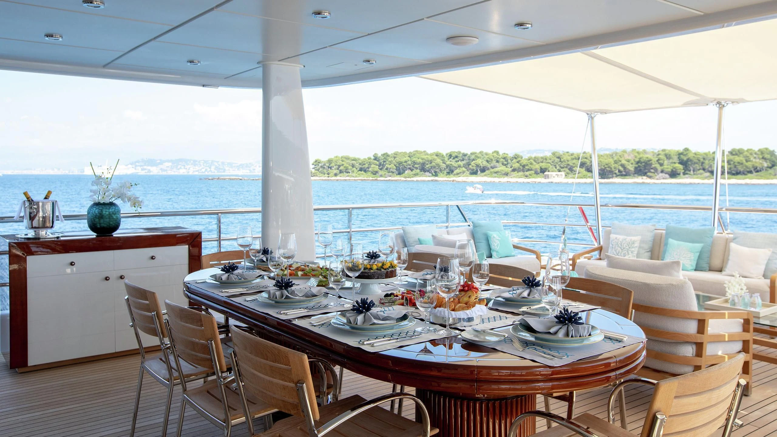 a table set for a meal aboard LA MIRAGE Yacht for Sale