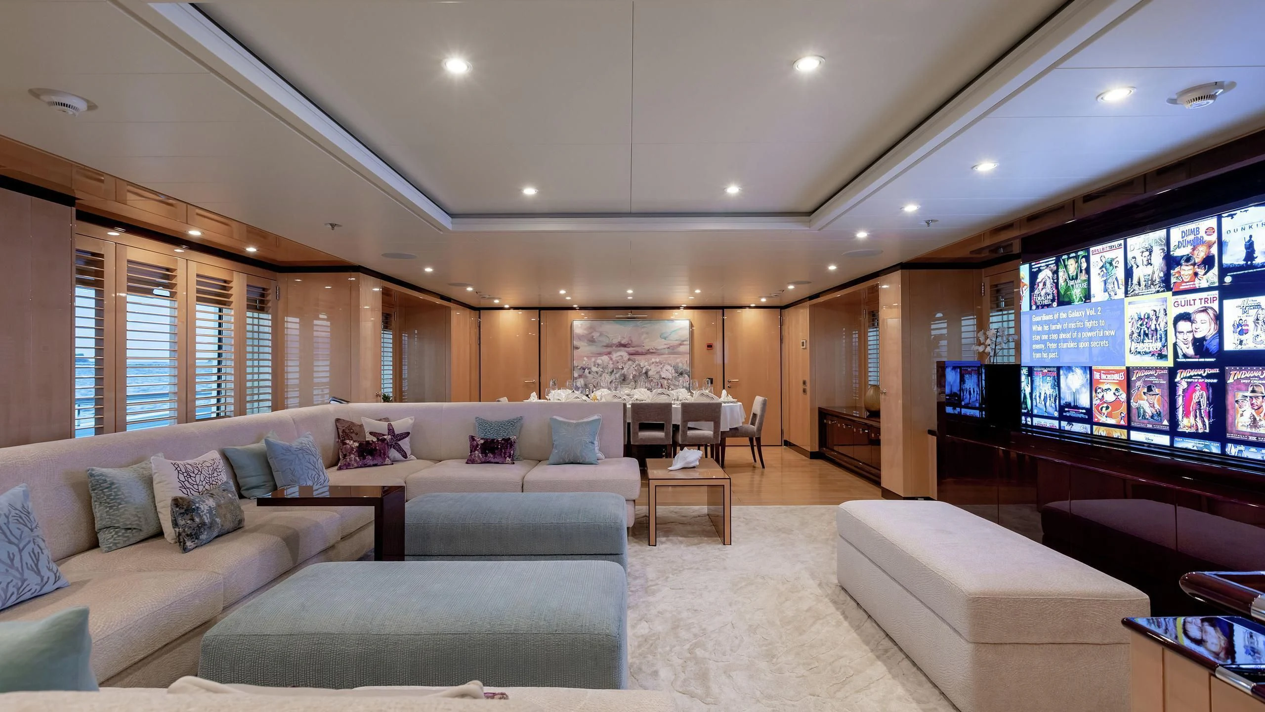 a living room with a large window aboard LA MIRAGE Yacht for Sale