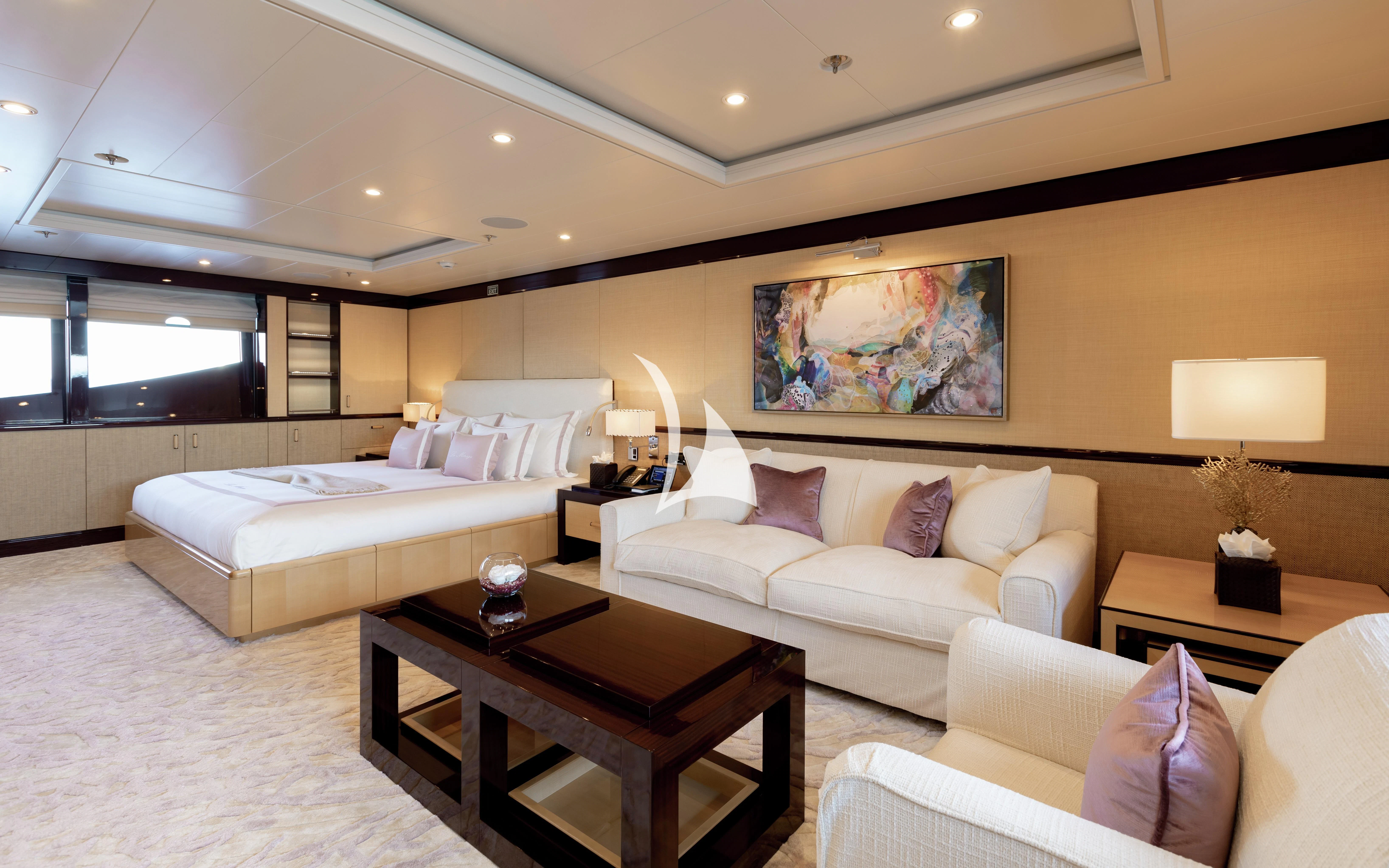 a living room with a couch and a coffee table aboard LA MIRAGE Yacht for Sale