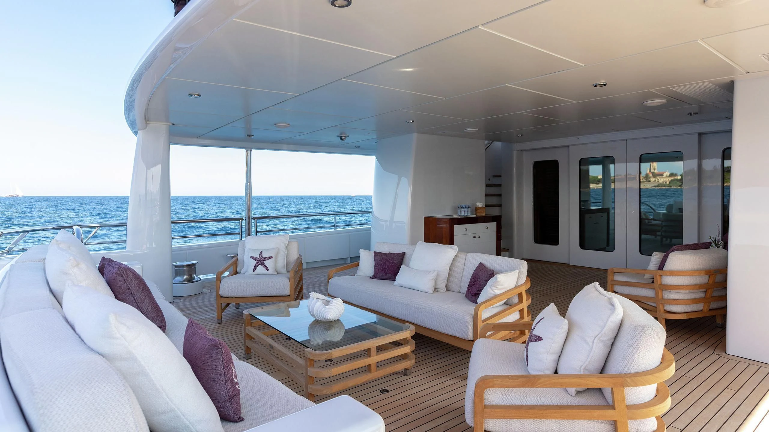 a living room with a large window aboard LA MIRAGE Yacht for Sale