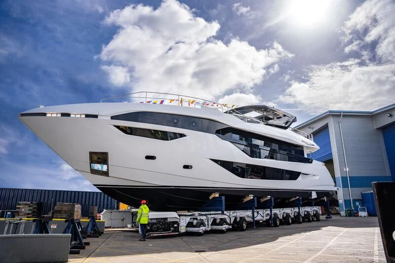 a large cruise ship docked aboard IKAL Yacht for Sale