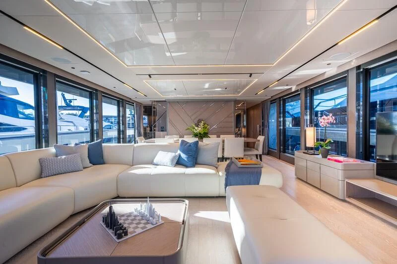 a living room with a large window aboard IKAL Yacht for Sale