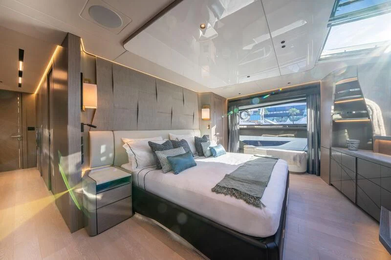 a bedroom with a large bed aboard IKAL Yacht for Sale