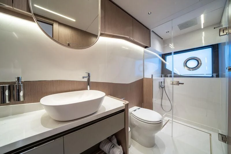 a bathroom with a sink and toilet aboard IKAL Yacht for Sale