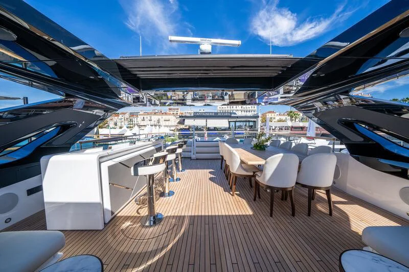 a deck with a deck and chairs aboard IKAL Yacht for Sale