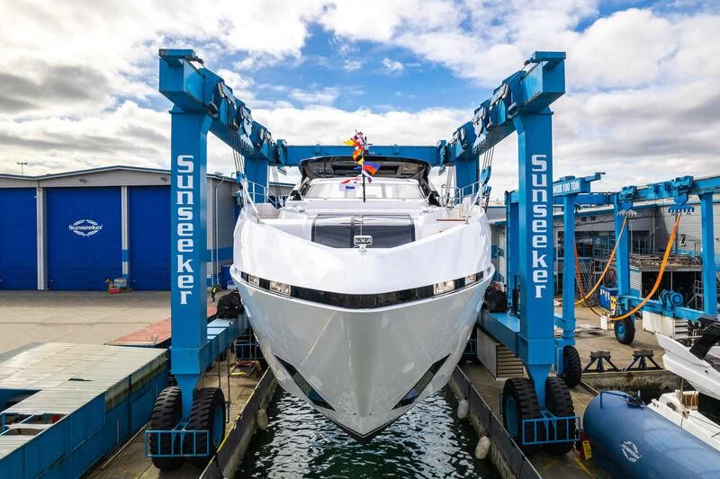 a boat docked at a port aboard IKAL Yacht for Sale