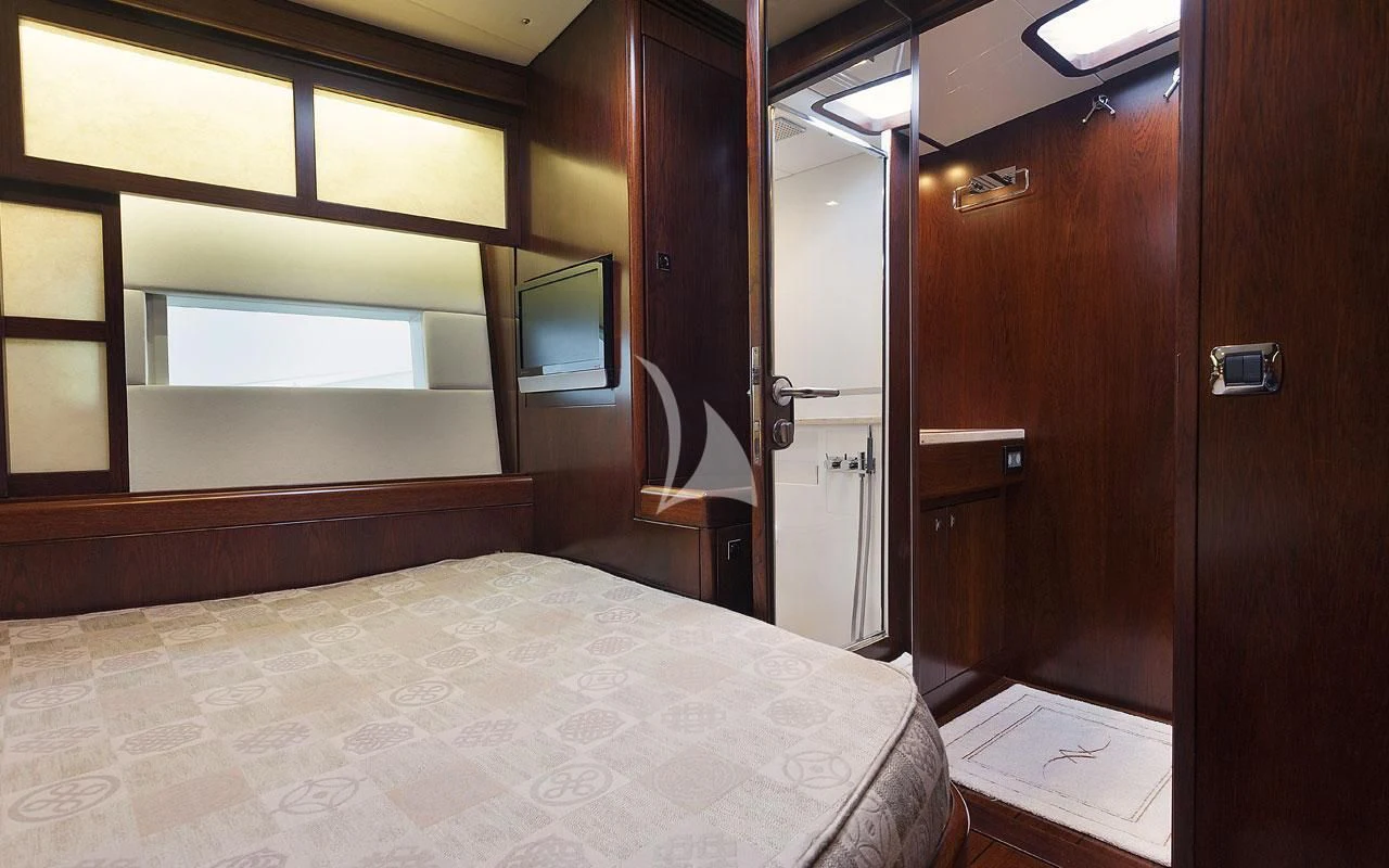 a bed in a room aboard FAR AND WIDE Yacht for Sale