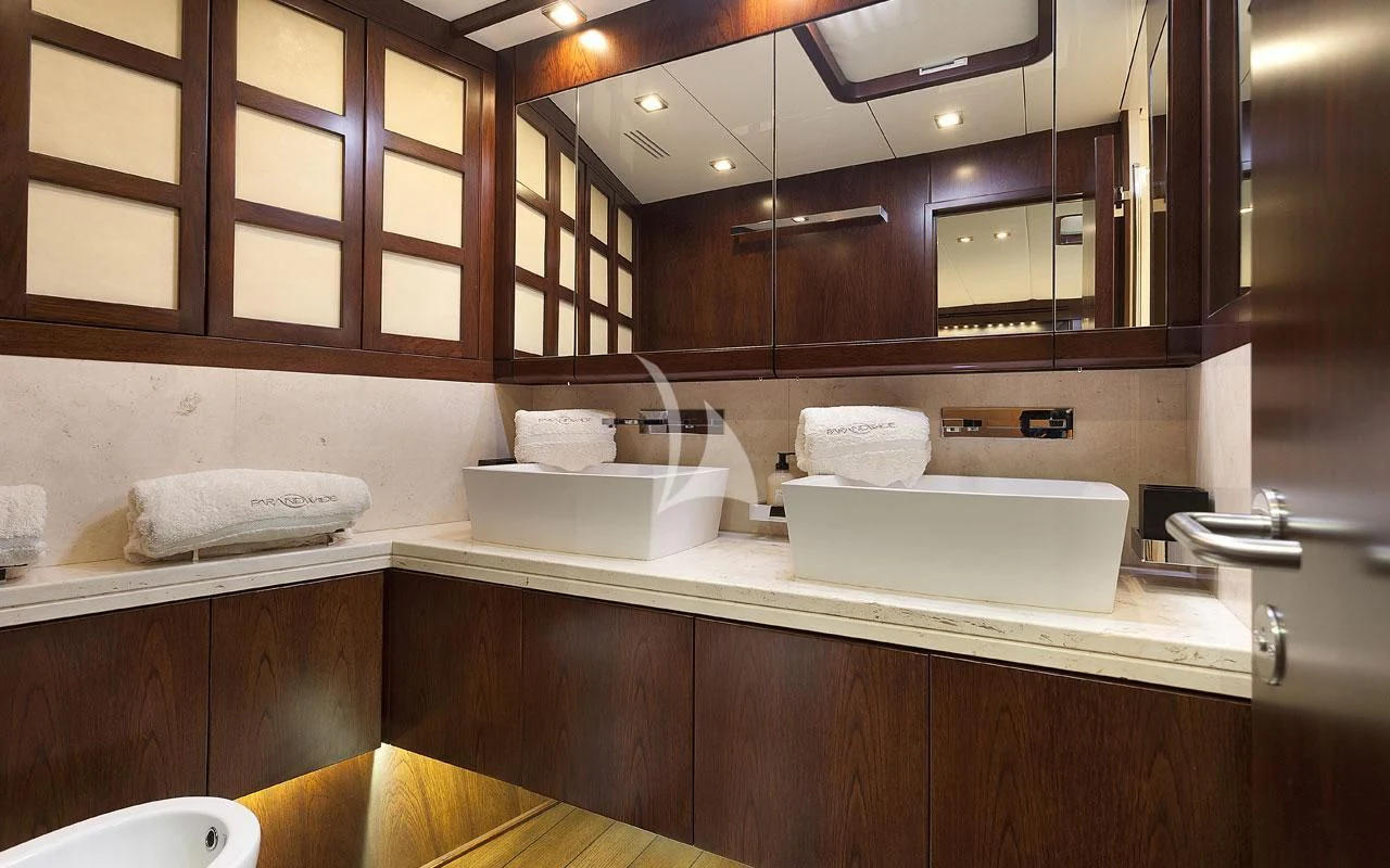 a bathroom with a sink and a mirror aboard FAR AND WIDE Yacht for Sale