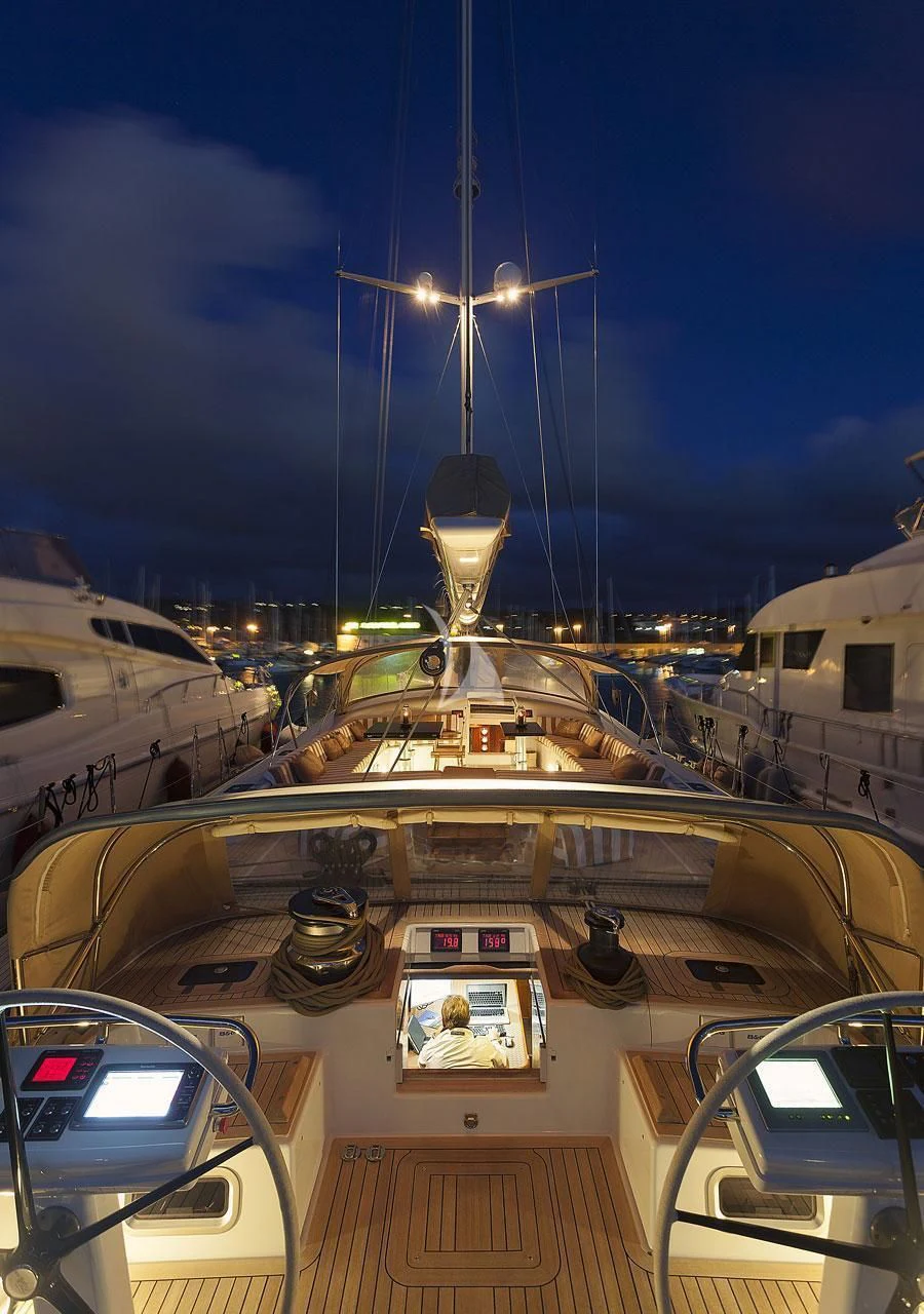 a view of the deck of a boat with a ferris wheel and a person in a car with aboard FAR AND WIDE Yacht for Sale