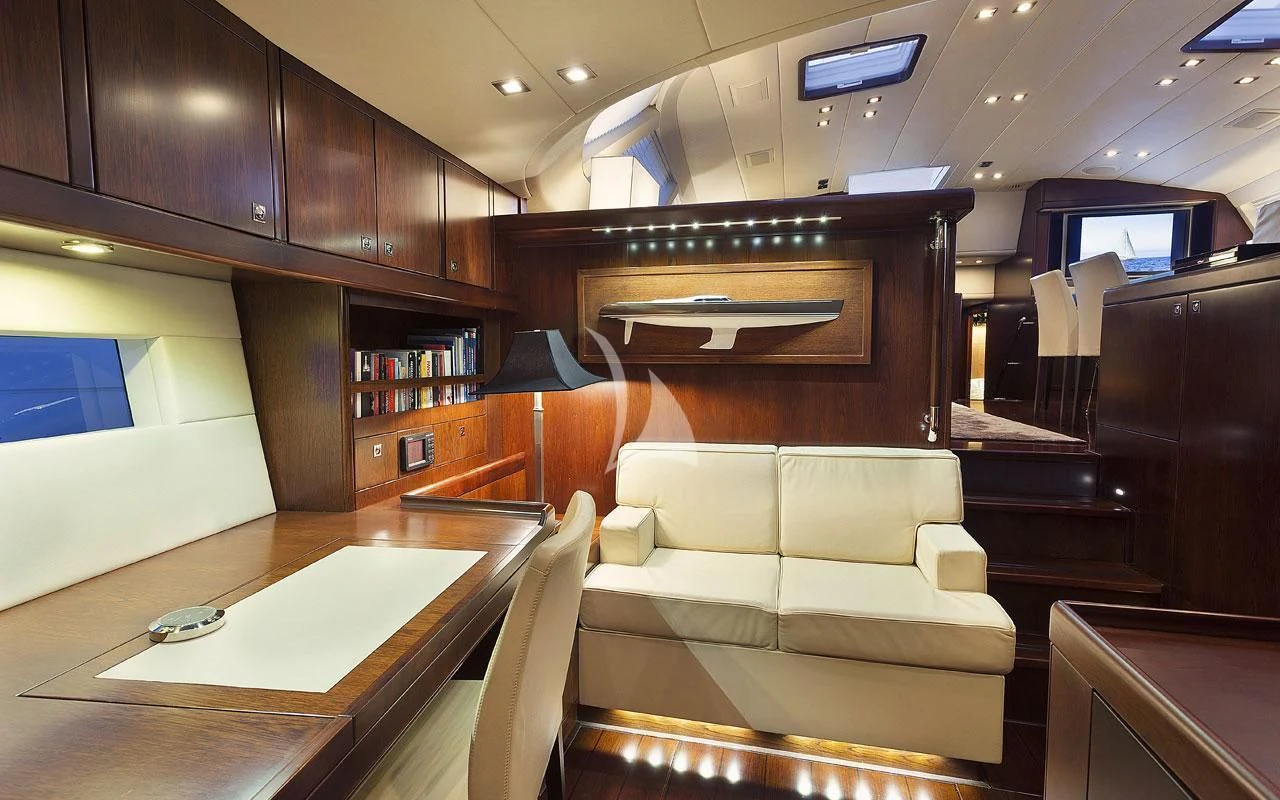 a living room with a couch and a table aboard FAR AND WIDE Yacht for Sale