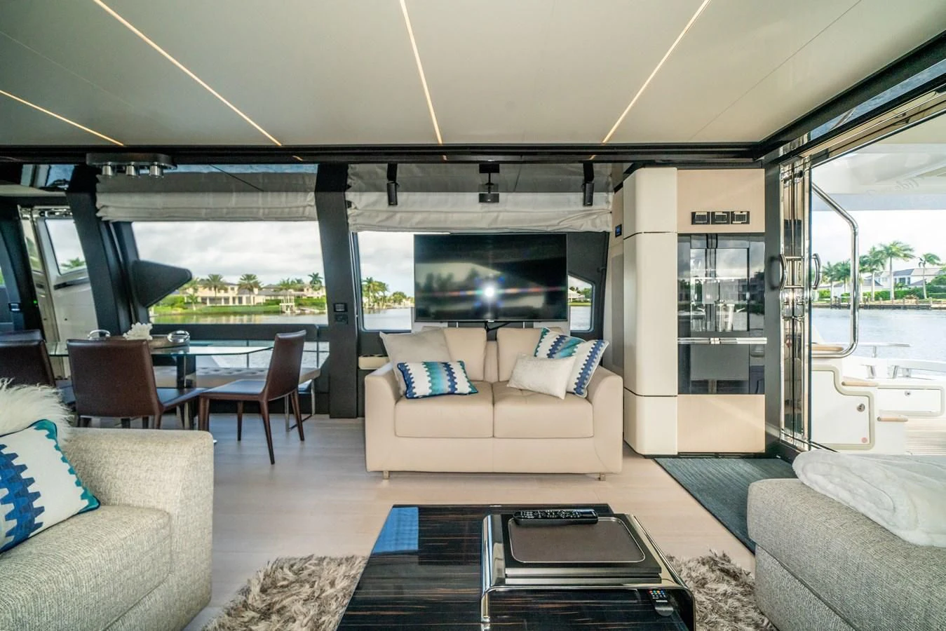 a living room with a large ocean aboard CIAO BELLA Yacht for Sale