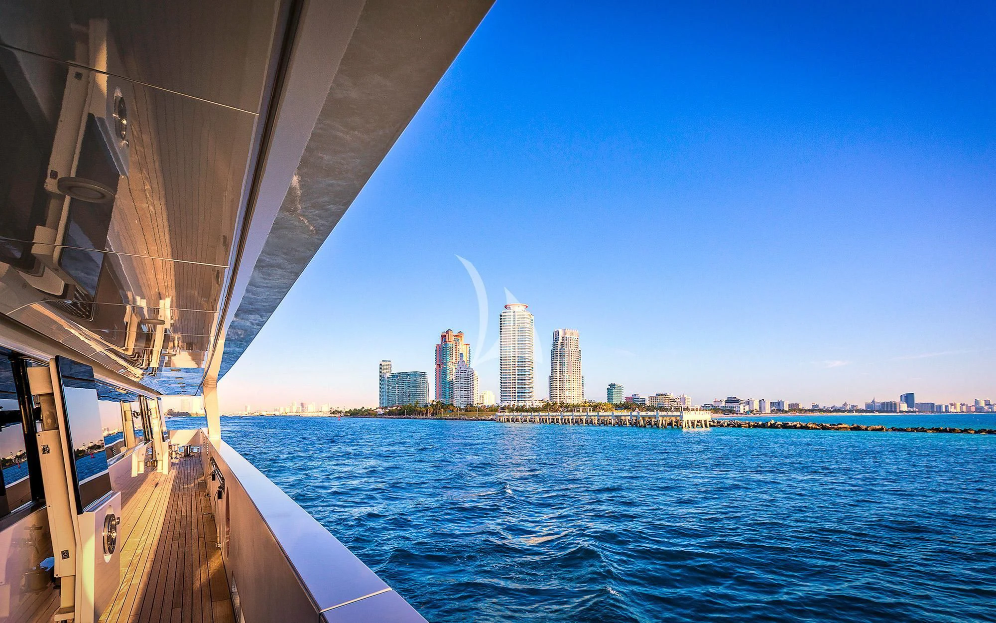 a body of water with a city in the background aboard VICKY Yacht for Charter