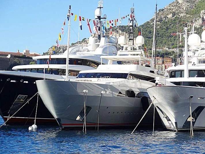 several boats docked at a pier aboard VICKY Yacht for Charter