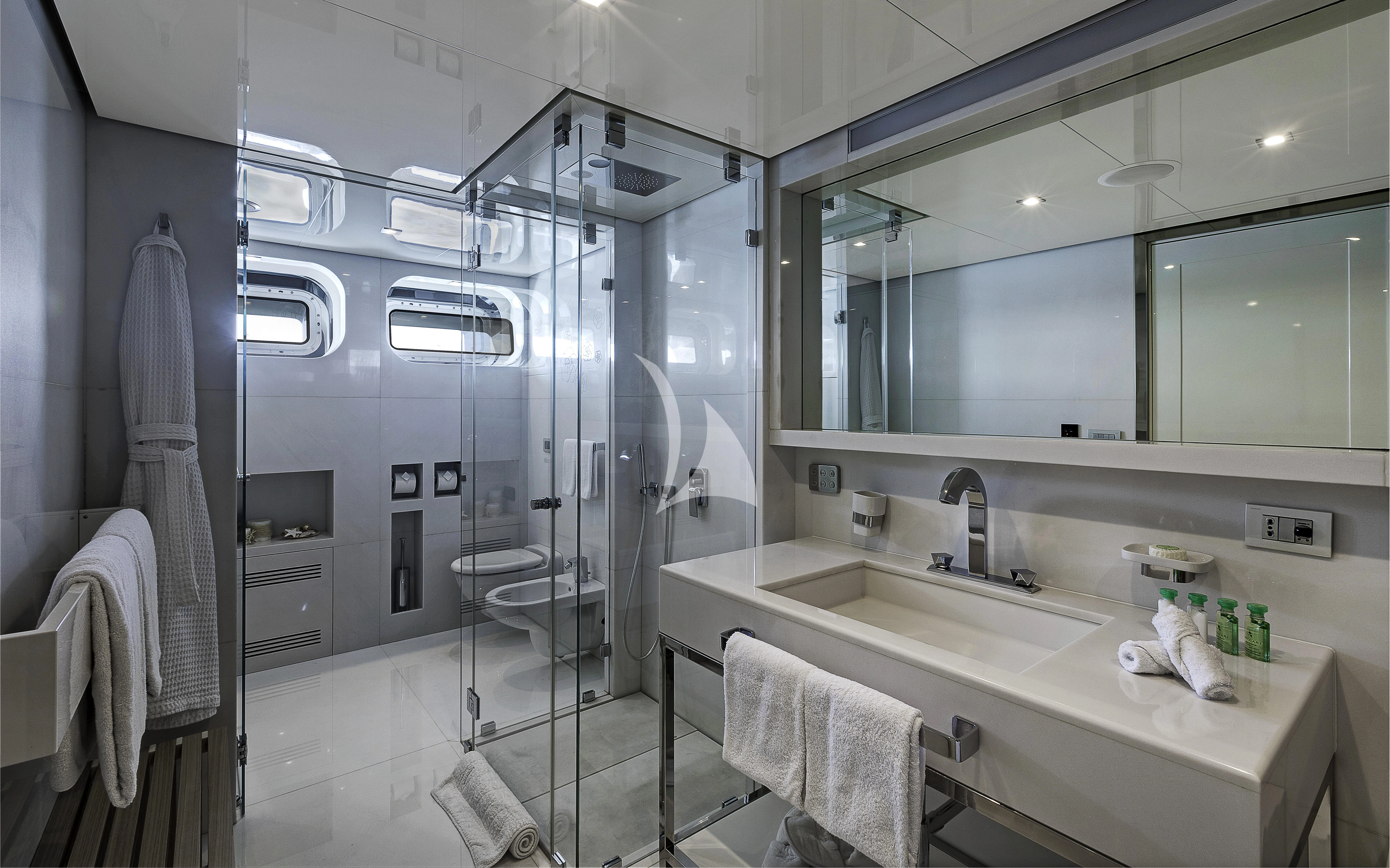 a bathroom with a glass shower aboard VICKY Yacht for Charter