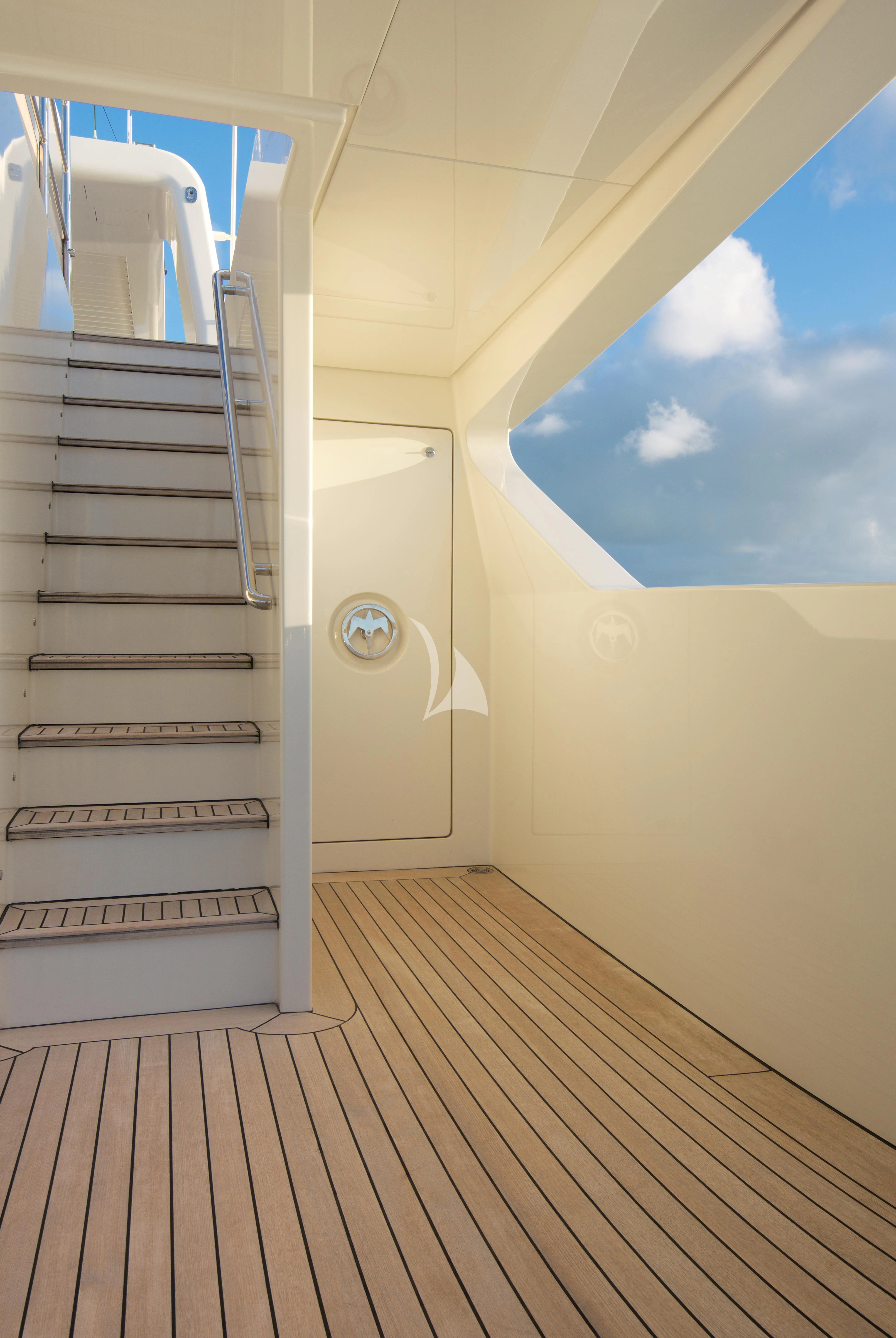 a staircase with a glass door aboard VICKY Yacht for Charter