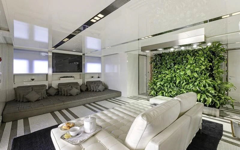 a living room with a couch and a table aboard VICKY Yacht for Charter