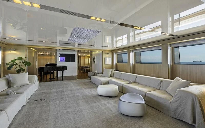 a living room with white couches aboard VICKY Yacht for Charter