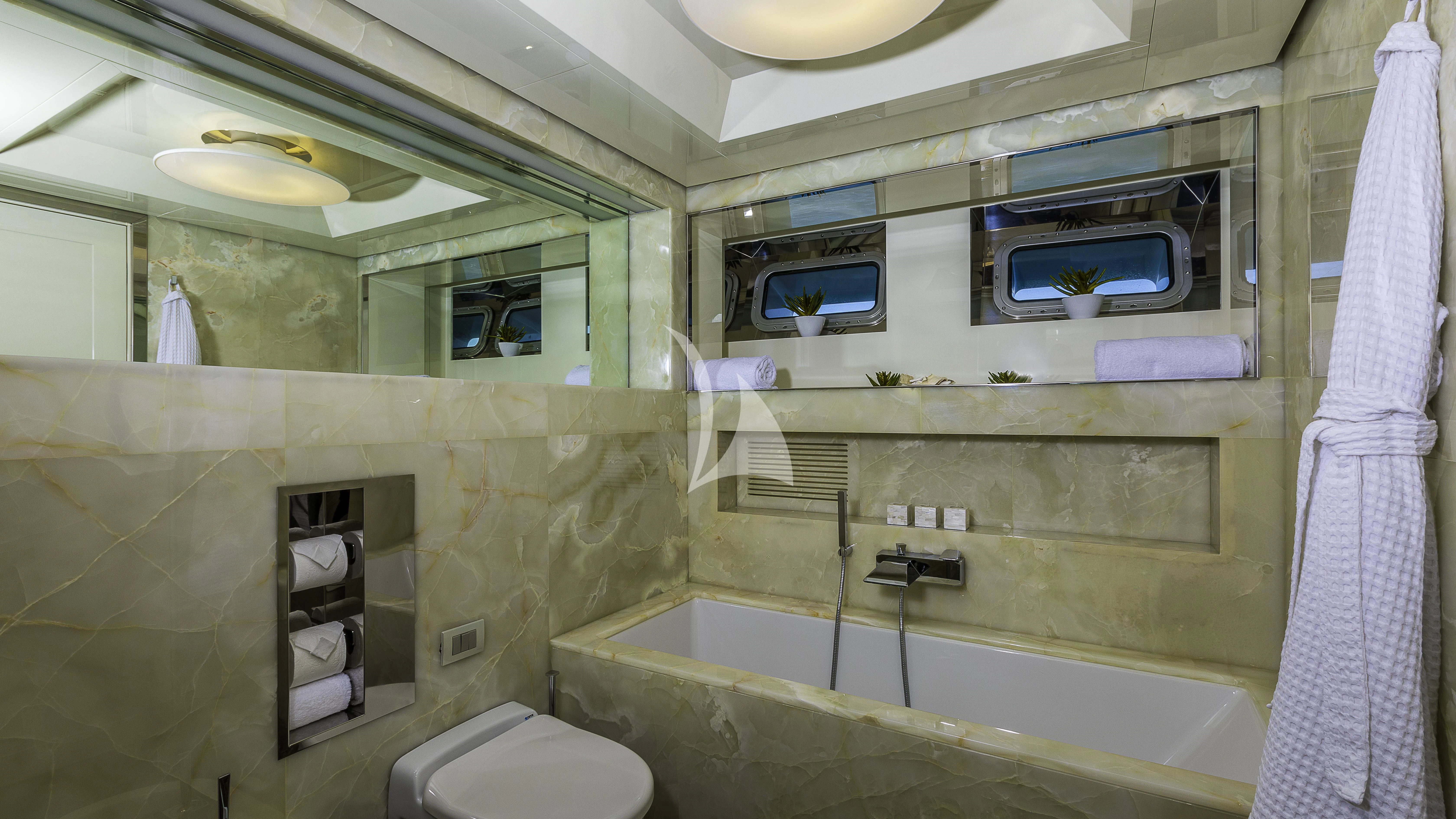 a bathroom with a bathtub and sink aboard VICKY Yacht for Charter