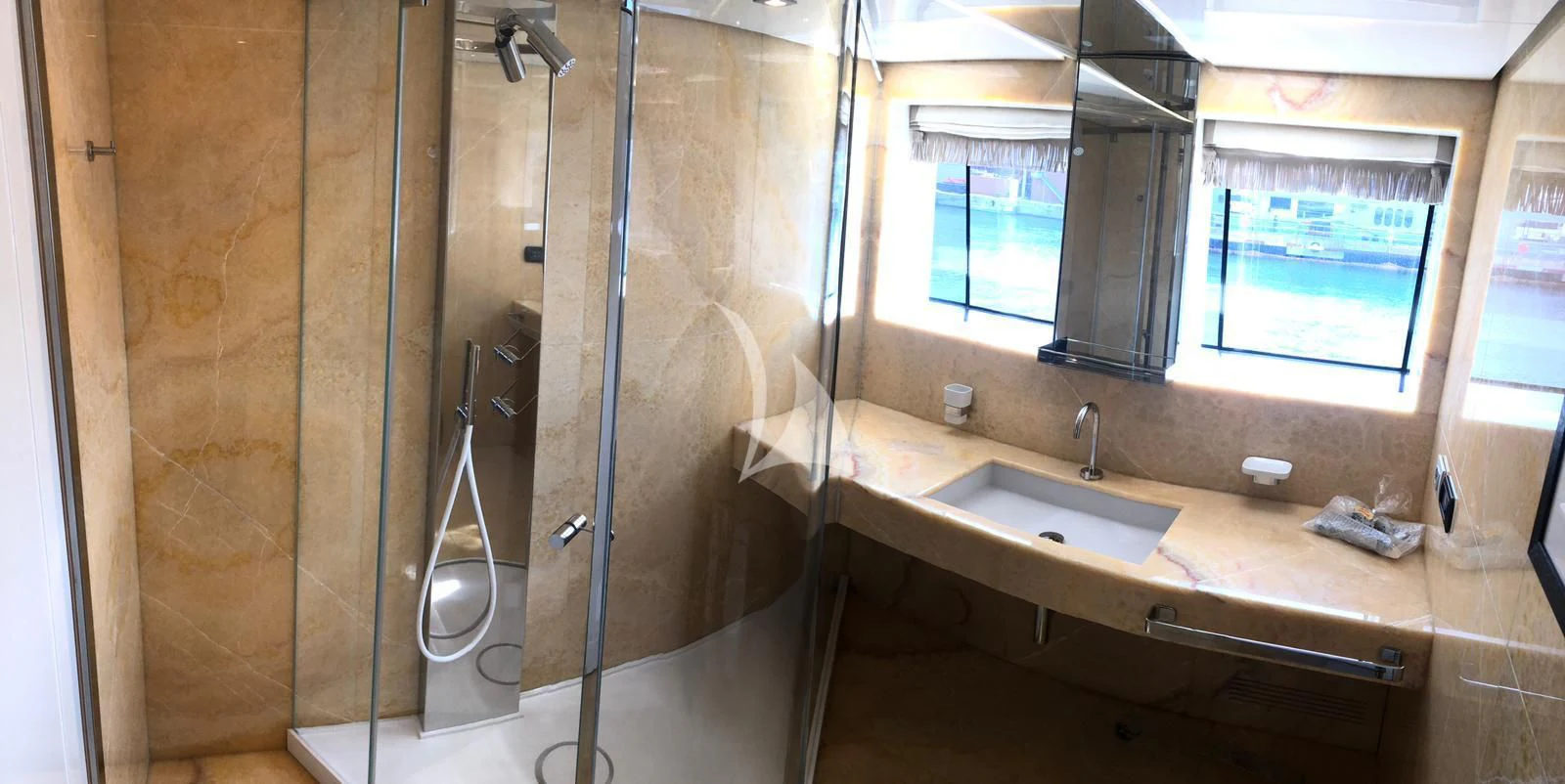 a bathroom with a glass shower aboard VICKY Yacht for Charter