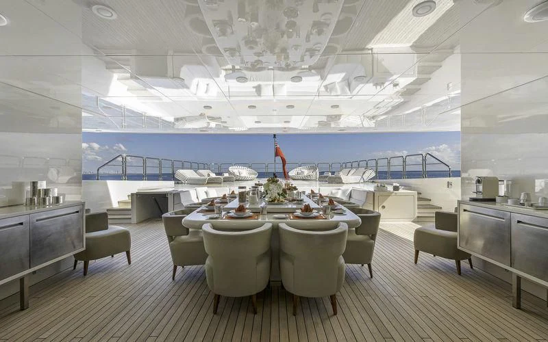 a large kitchen with a table and chairs aboard VICKY Yacht for Charter