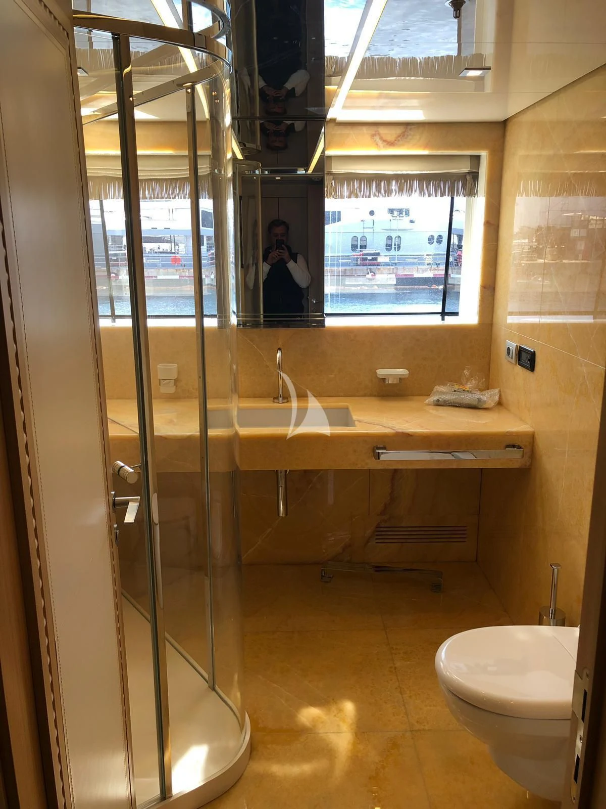 a bathroom with a large glass shower aboard VICKY Yacht for Charter
