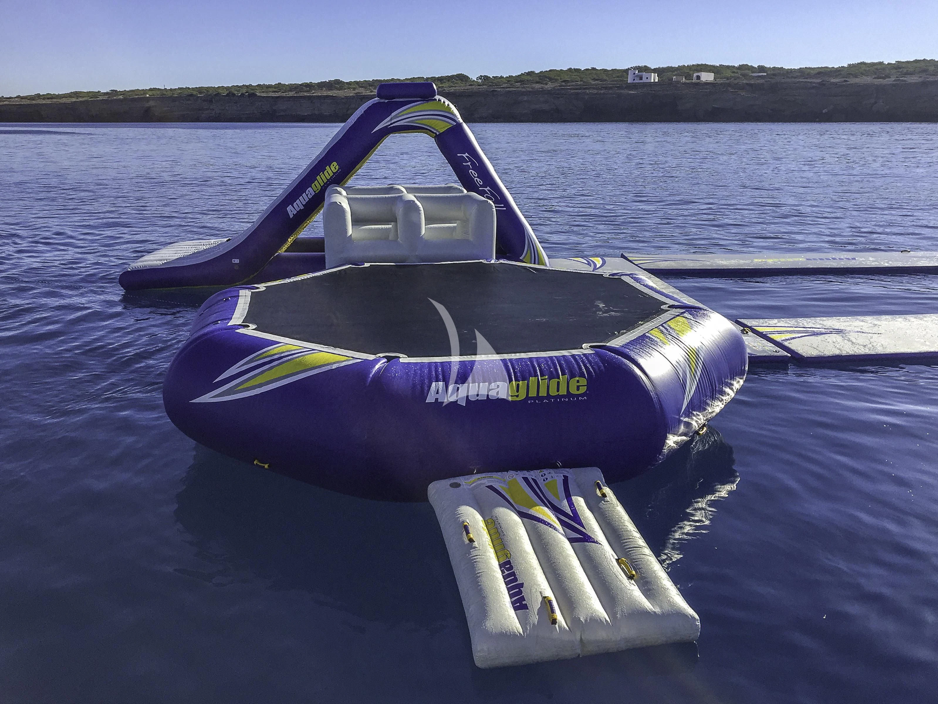 a blue and white jet ski on a lake aboard VICKY Yacht for Charter