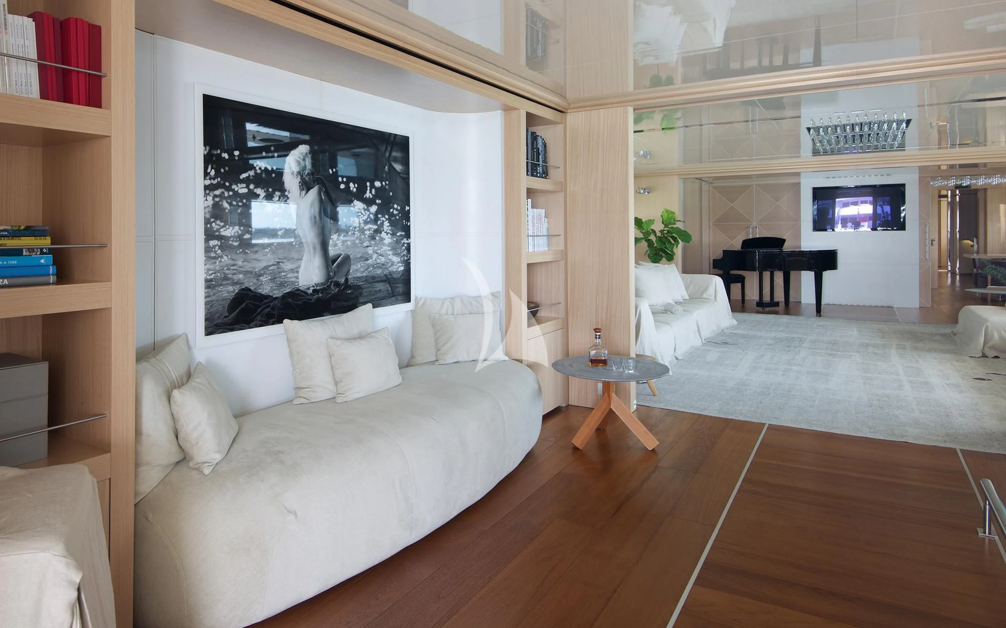 a living room with a large screen aboard VICKY Yacht for Charter