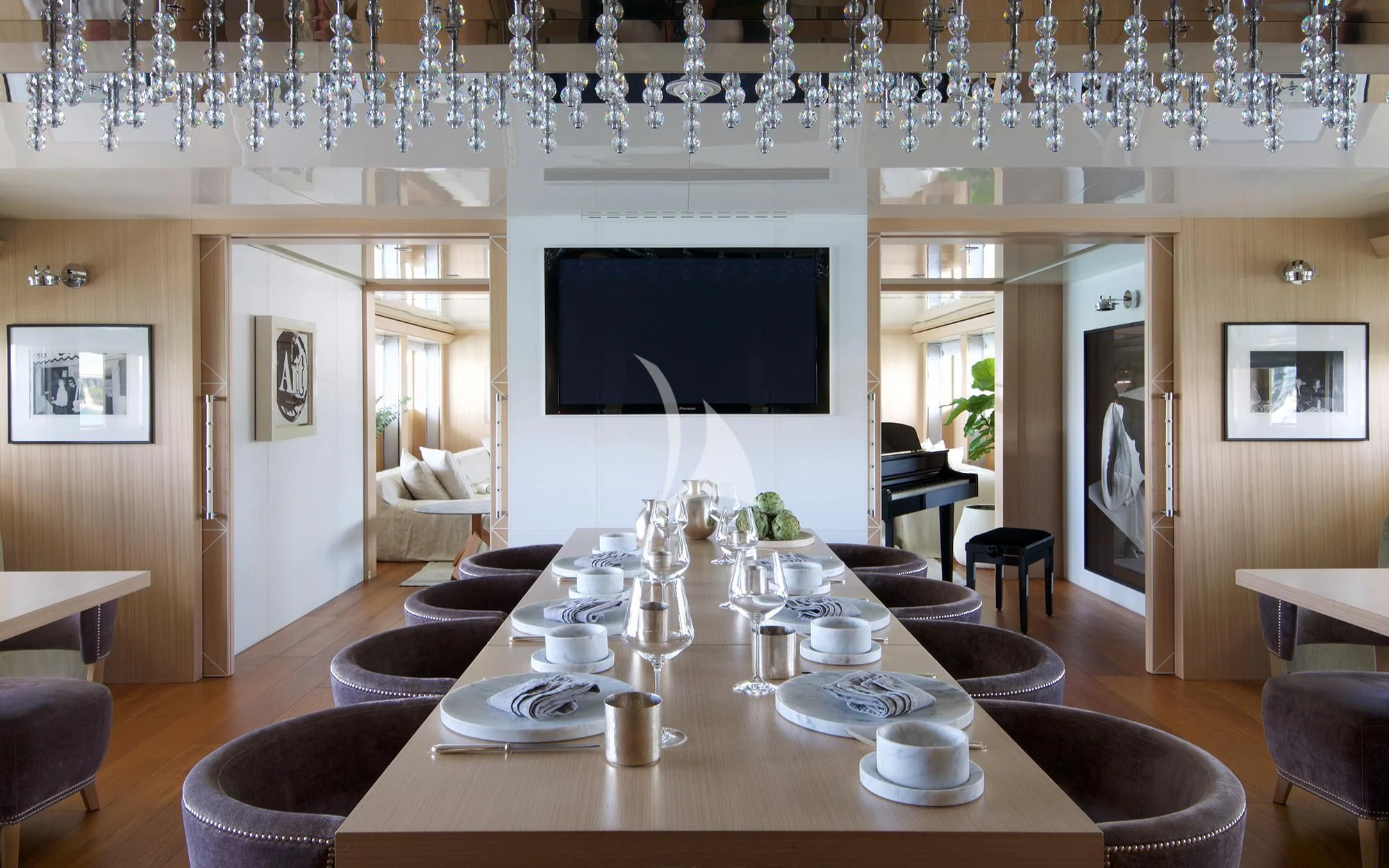 a large room with a table and chairs aboard VICKY Yacht for Charter