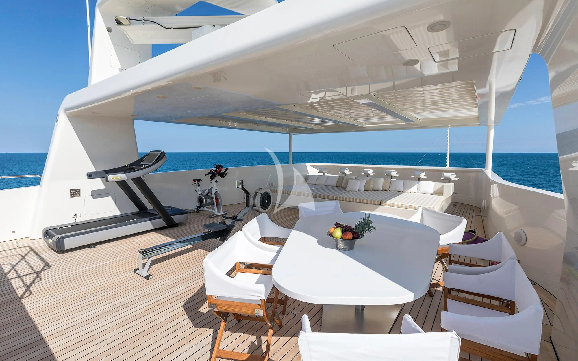 a white yacht with a table and chairs aboard VICKY Yacht for Charter