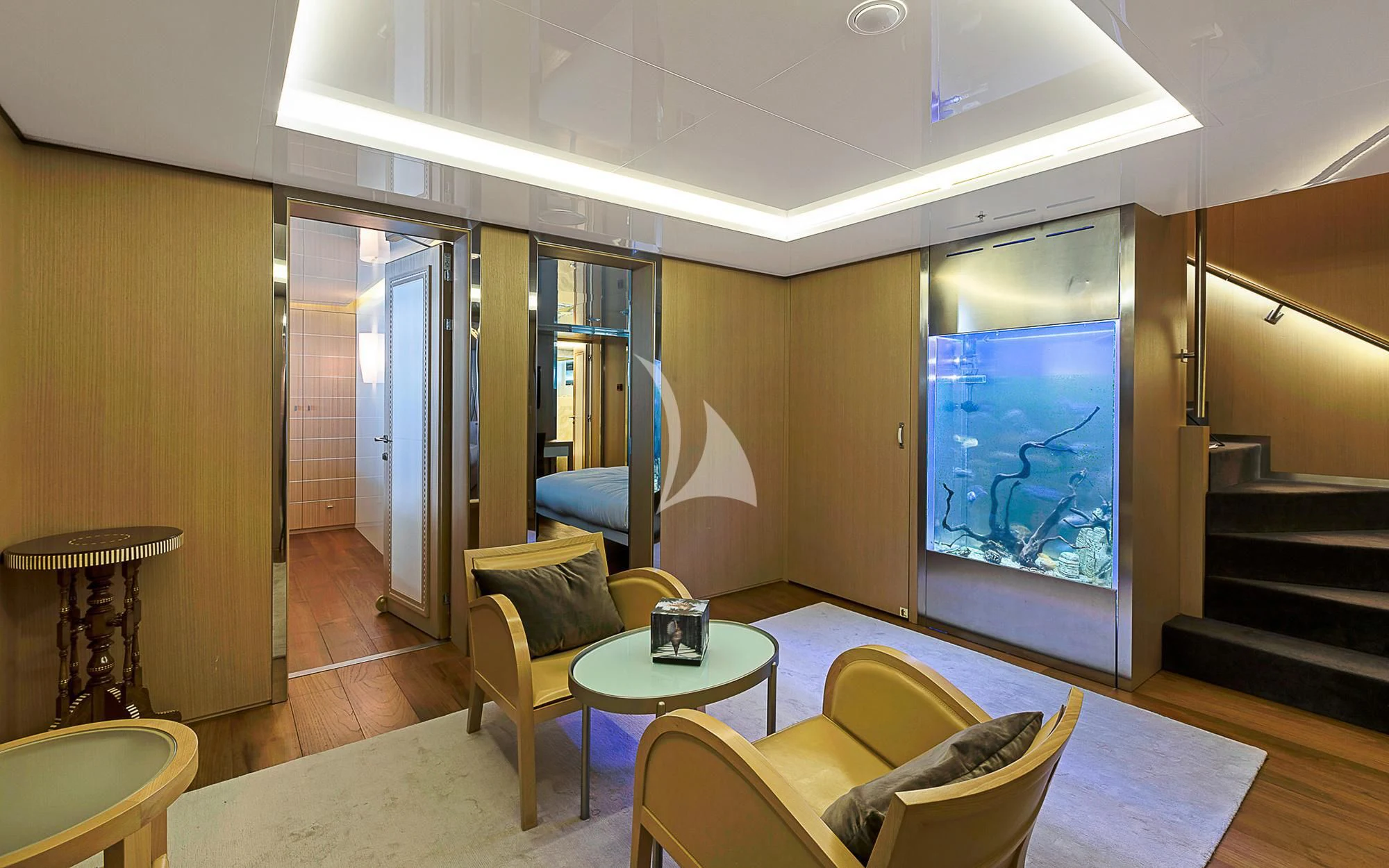 a room with chairs and a table aboard VICKY Yacht for Charter