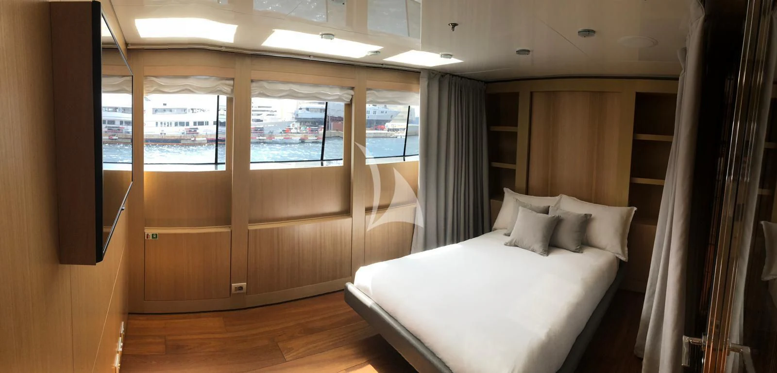 a room with a bed and a window aboard VICKY Yacht for Charter