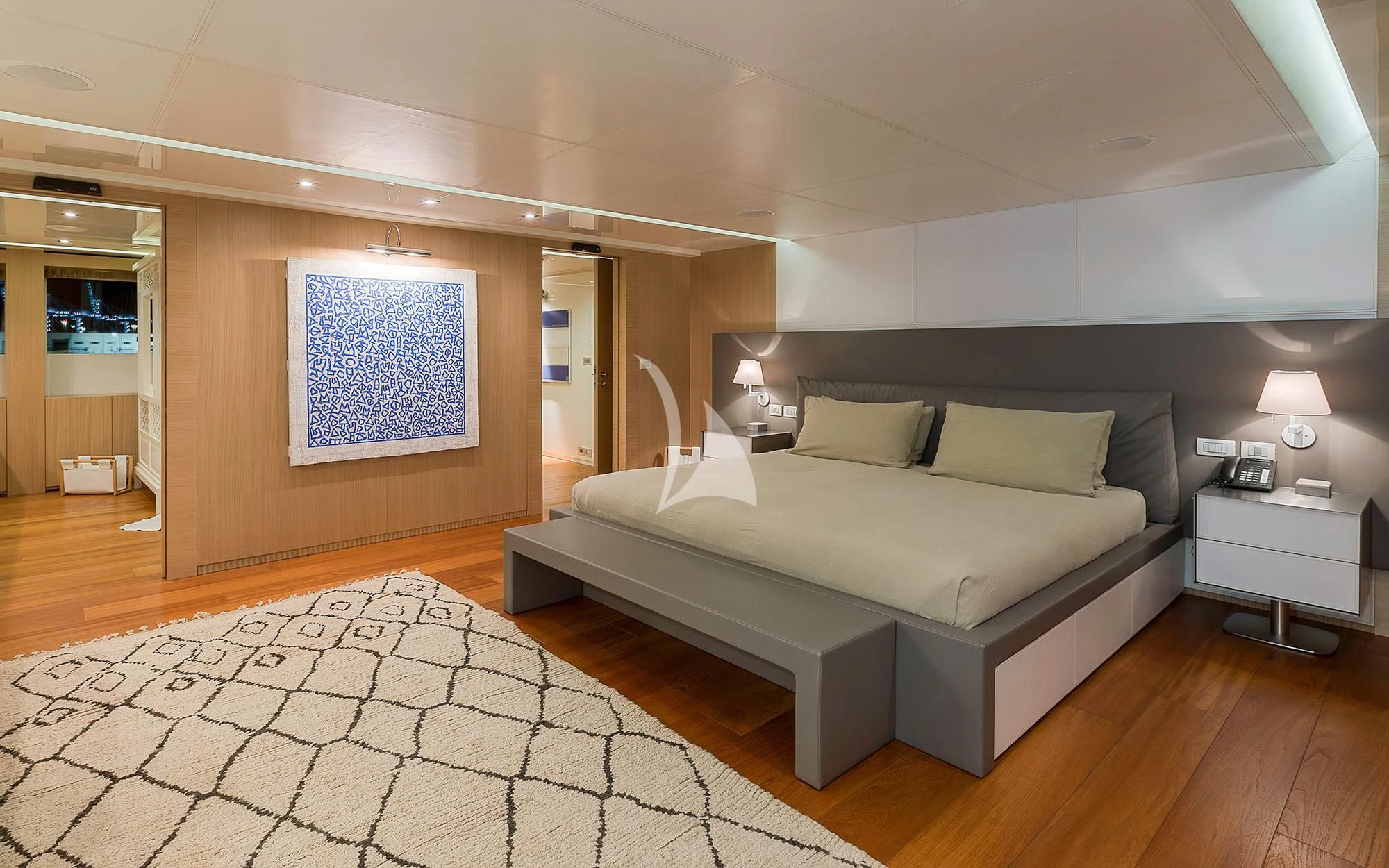 a large bedroom with a large bed aboard VICKY Yacht for Charter