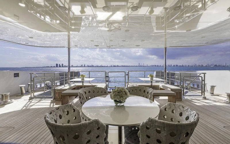 a room with a table and chairs aboard VICKY Yacht for Charter