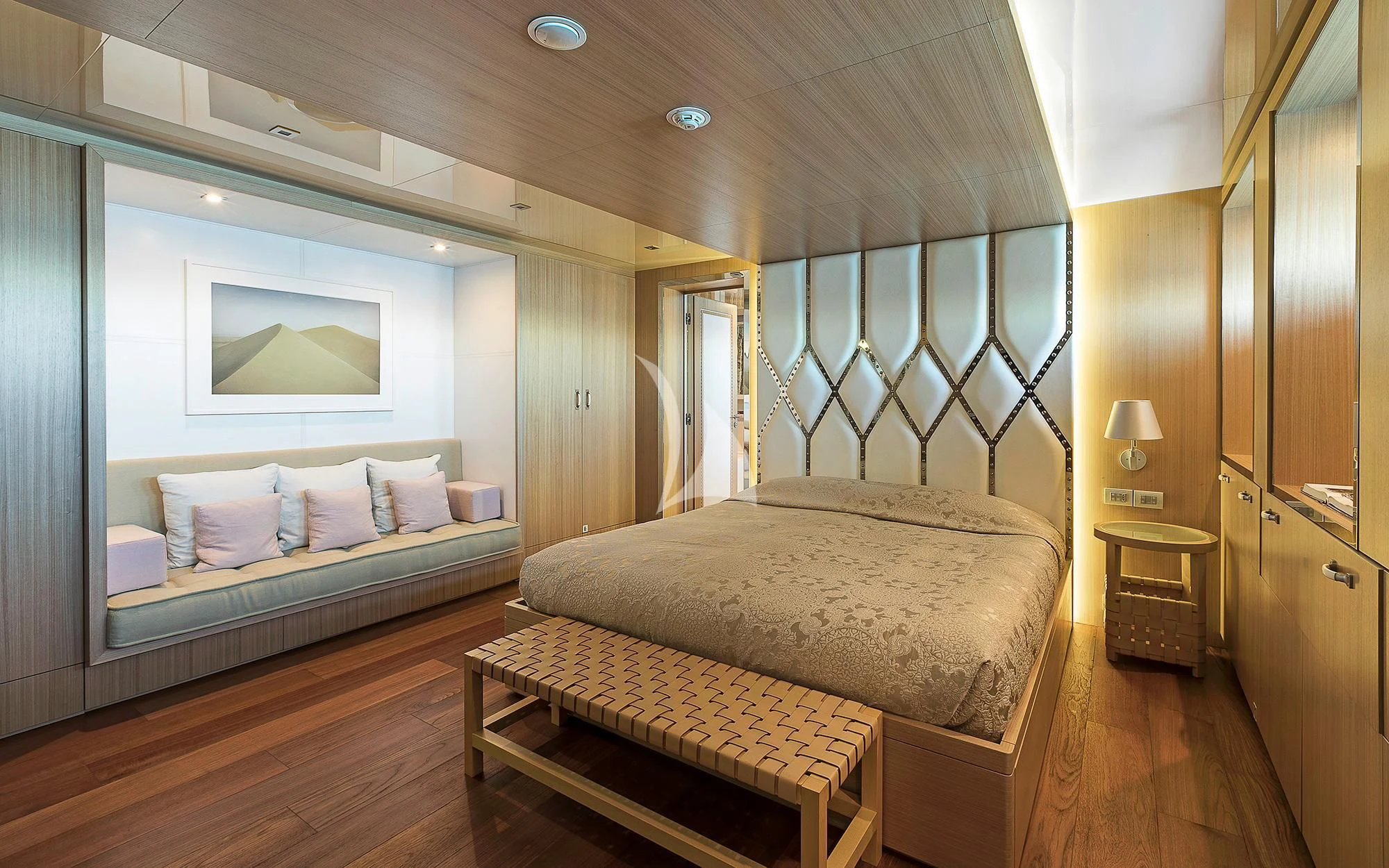 a bedroom with a bed and a mirror aboard VICKY Yacht for Charter