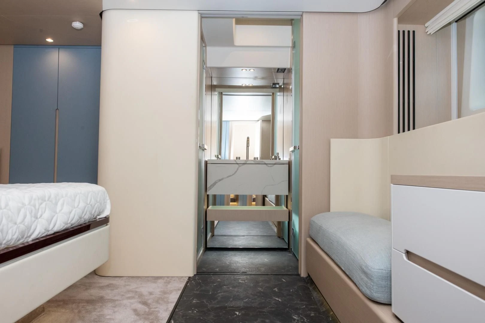 a room with a bed and a mirror aboard CRIMSON Yacht for Sale
