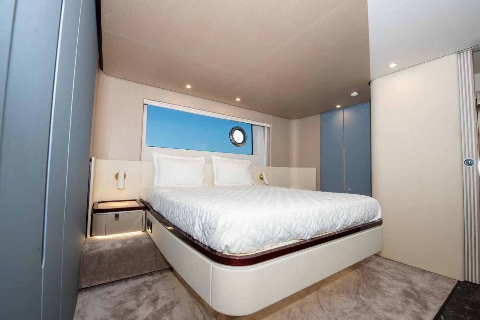 a bedroom with a bed aboard CRIMSON Yacht for Sale