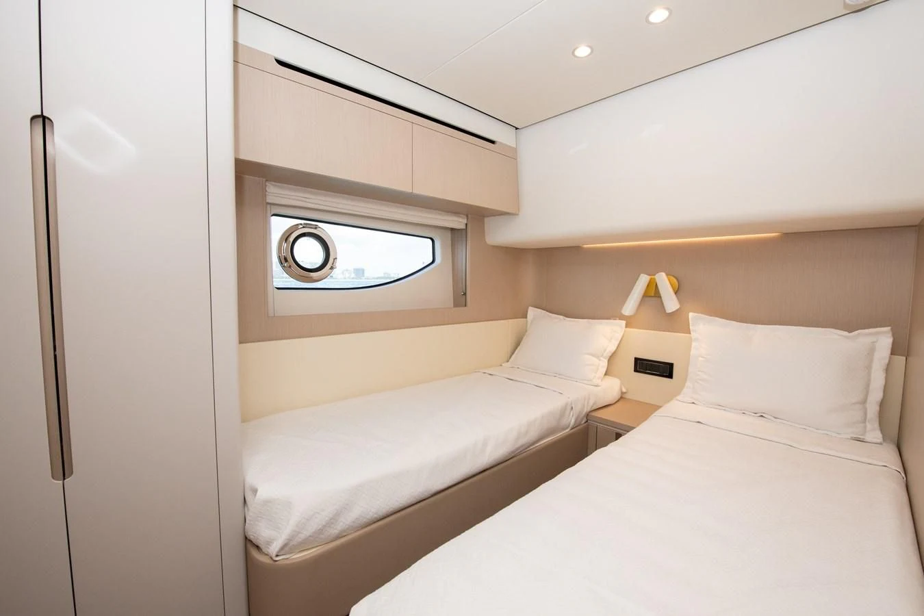 a room with two beds aboard CRIMSON Yacht for Sale