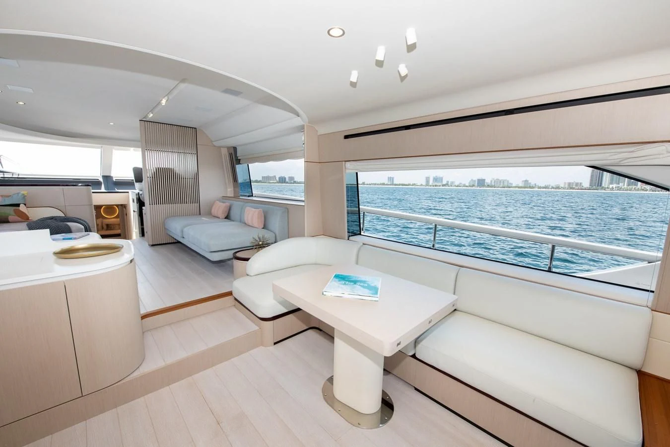 a room with a bed and a table aboard CRIMSON Yacht for Sale