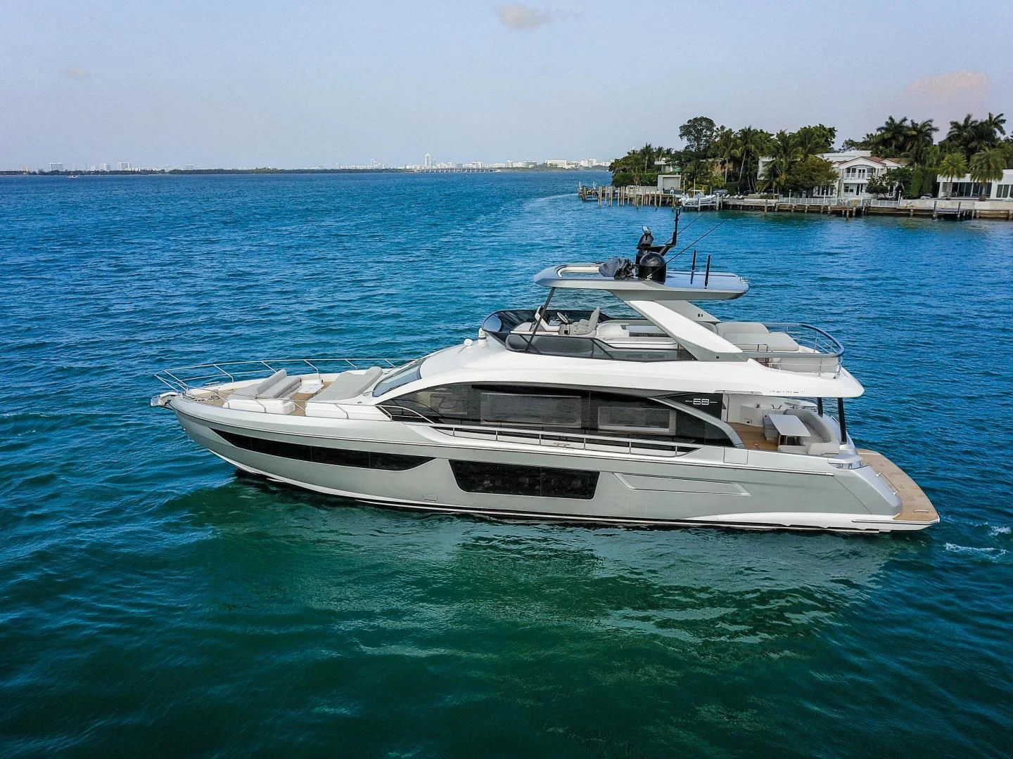 a white boat in the water aboard CRIMSON Yacht for Sale