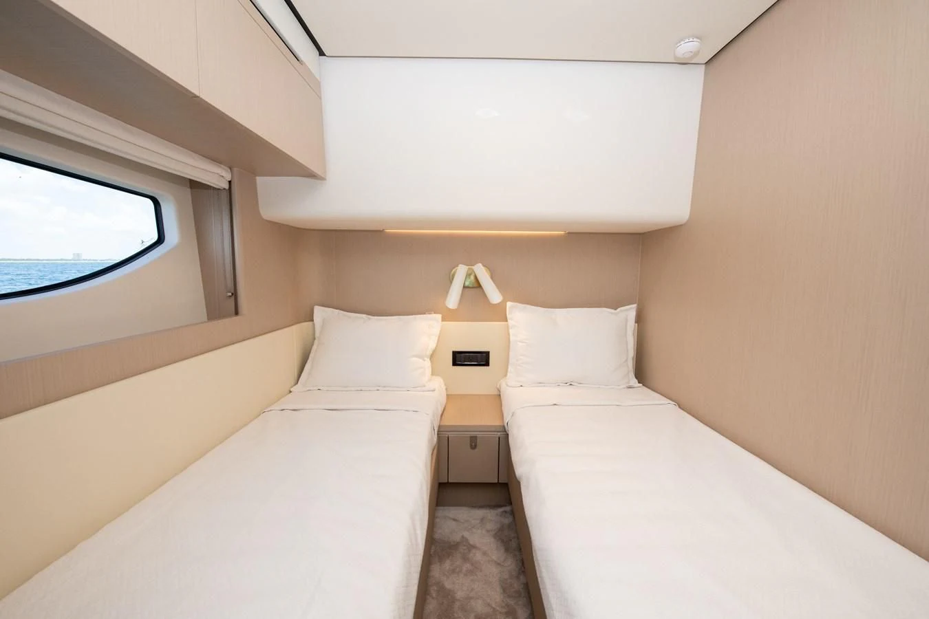 a room with two beds aboard CRIMSON Yacht for Sale