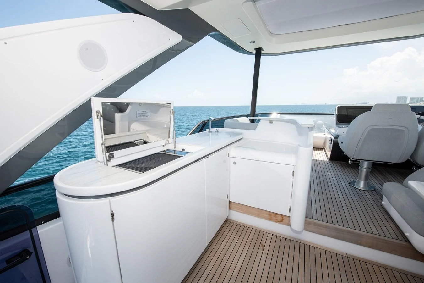 a boat with a sink and a chair aboard CRIMSON Yacht for Sale