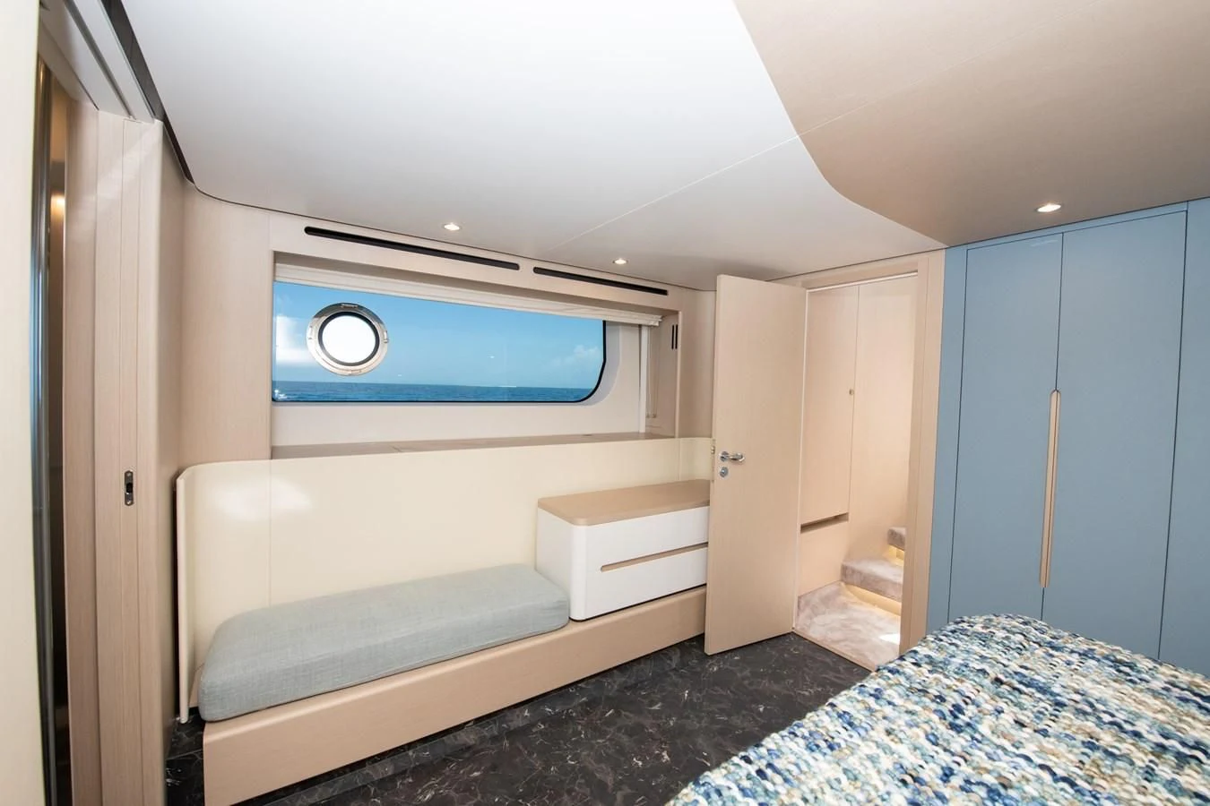 a room with a bed and a blue door aboard CRIMSON Yacht for Sale