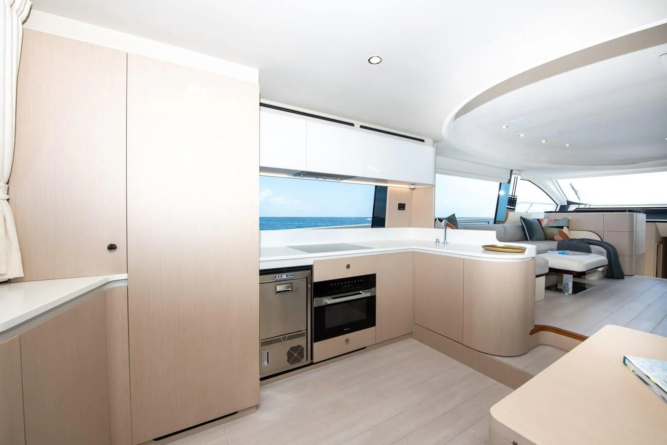a kitchen with a large window aboard CRIMSON Yacht for Sale