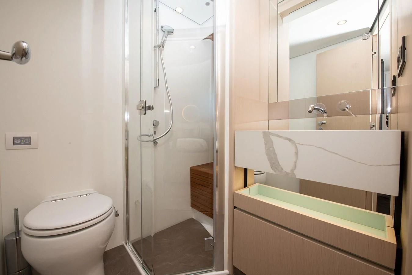 a bathroom with a tub toilet and sink aboard CRIMSON Yacht for Sale