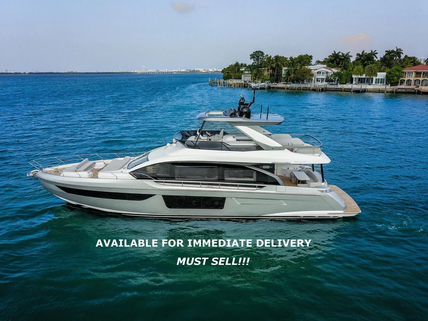 a white boat in the water aboard CRIMSON Yacht for Sale