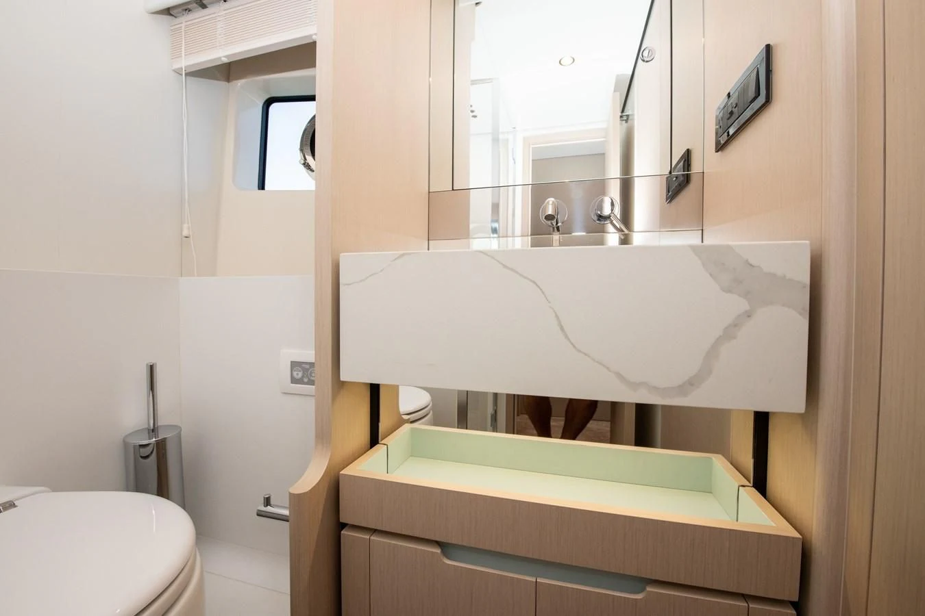 a bathroom with a sink and a toilet aboard CRIMSON Yacht for Sale