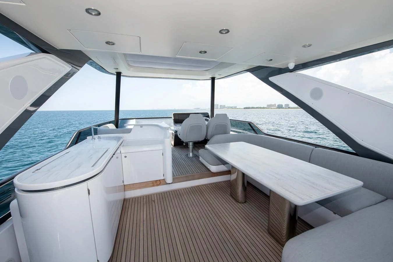 a boat with white seats aboard CRIMSON Yacht for Sale