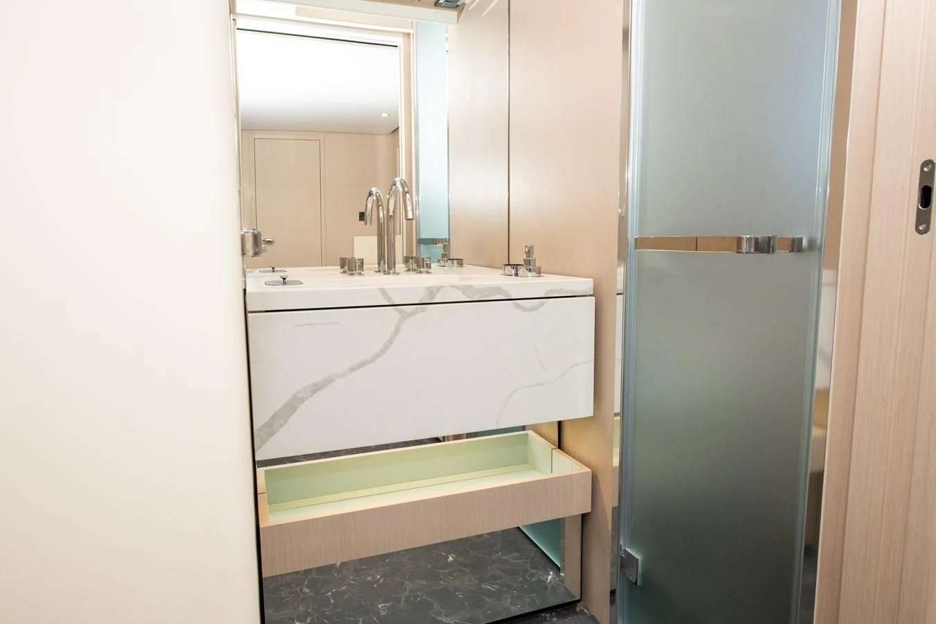 a bathroom with a sink and a mirror aboard CRIMSON Yacht for Sale