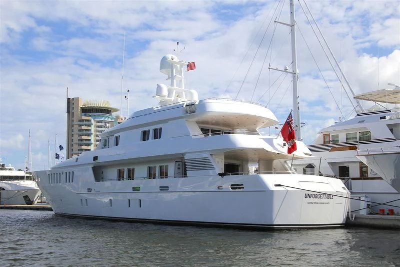 a large white boat in the water aboard UNFORGETTABLE Yacht for Sale